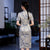 Vestido chino tradicional cheongsam de manga corta con patrón de geometría